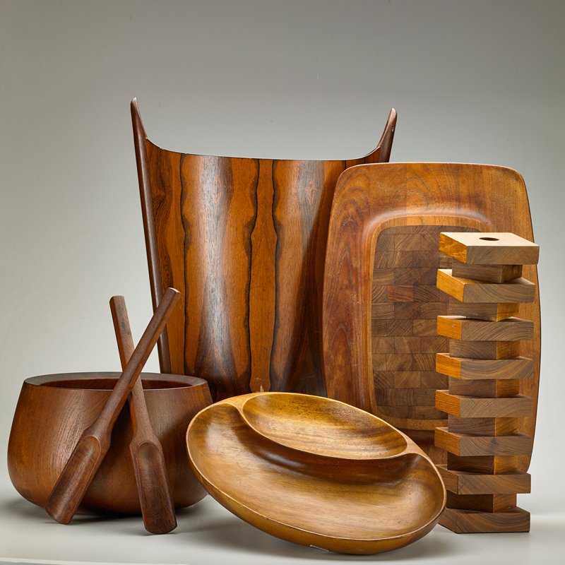 P.S. HEGGEN; JENS QUISTGAARD; DANSK: Six pieces: wastebasket, salad bowl and tongs, segmented bowl, tray, and candlestick, Denmark, ca 1960s; Rosewood, teak; Dansk marked; Wastebasket: 17 1/2" x 16" x 9"