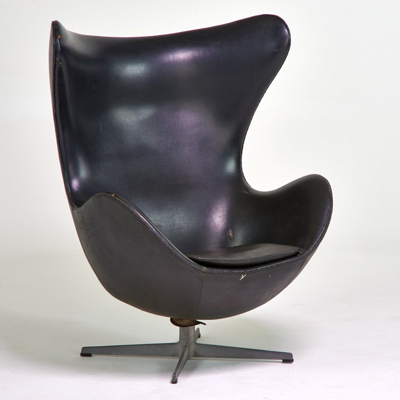 ARNE JACOBSEN; FRITZ HANSEN: Egg chair, Denmark, 1950s; Aluminum, vinyl; Raised signature to underside of base; 43" x 35" x 33"