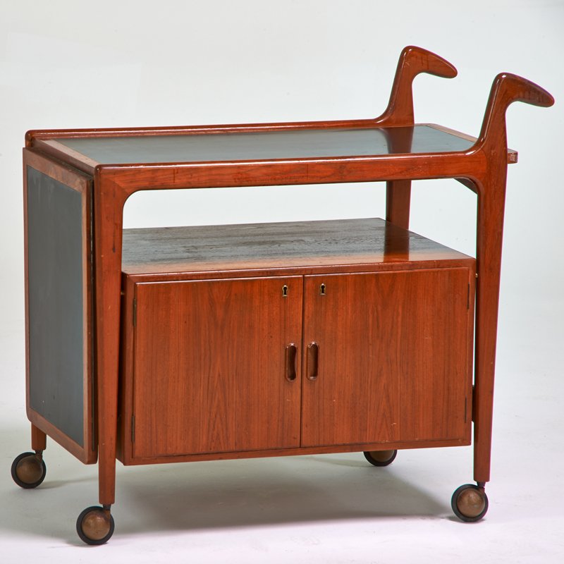 ARNE HOVMAND-OLSEN: Bar cart, Denmark, 1960s; Teak, laminate; Unmarked; Open: 35" x 56 1/2" x 20", closed: 35" x 35 1/2" x 20"