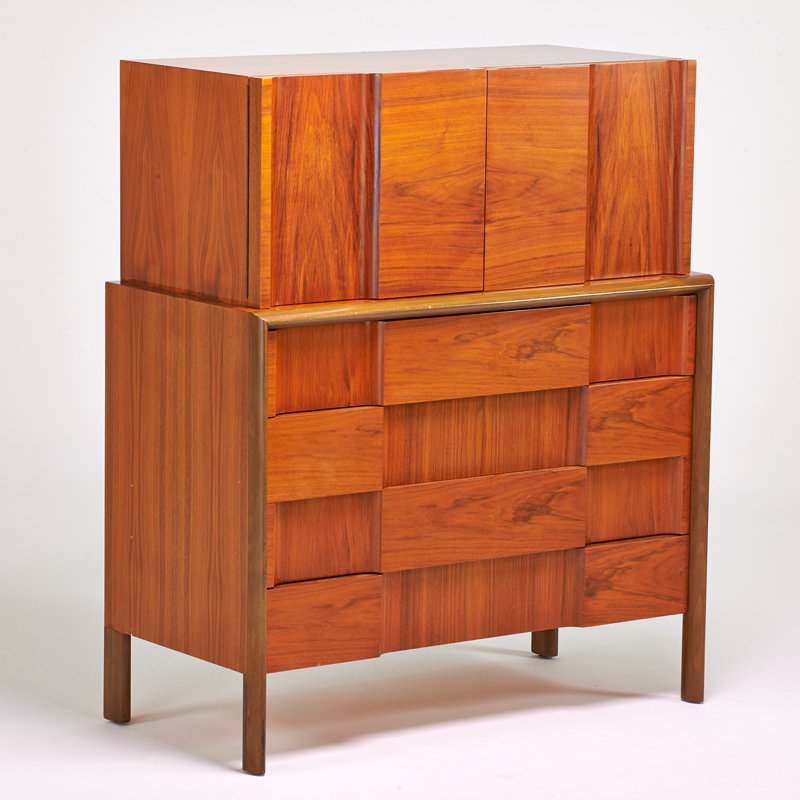 EDMUND SPENCE: Tall chest with two doors over four drawers, Sweden, 1950s; Figured walnut, stained and carved beech; Unmarked; 48 1/2" x 41 1/2" x 20"