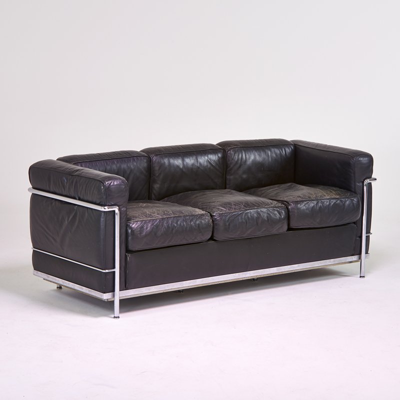 LE CORBUSIER; CASSINA: LC3" Sofa, Italy, 1980s; Chromed steel, leather; Stamped maker's mark; 27" x 27 1/2" x 73