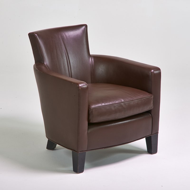 CHRISTIAN LIAIGRE; HOLLY HUNT: Lounge chair, 1990s; Leather, ebonized wood; Fabric manufacturer's label; 31 3/4" x 27 1/2" x 33"