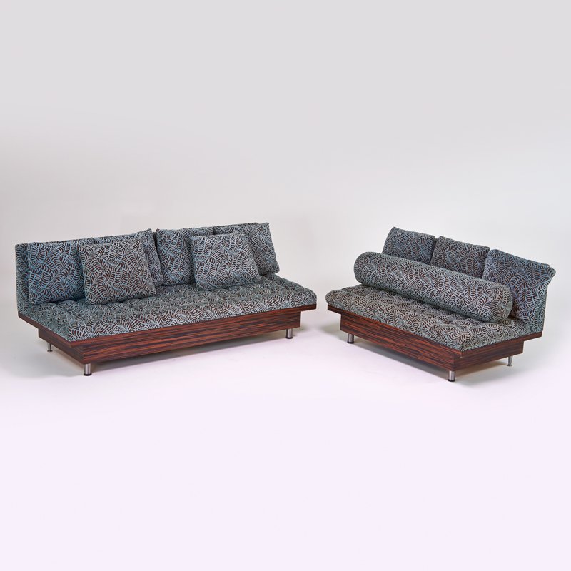 MODERN: Sofa and settee, USA, 1970s; Rosewood, matte chromed steel, upholstery; Unmarked; Sofa: 31" x 82" x 34", settee: 31" x 55" x 34"