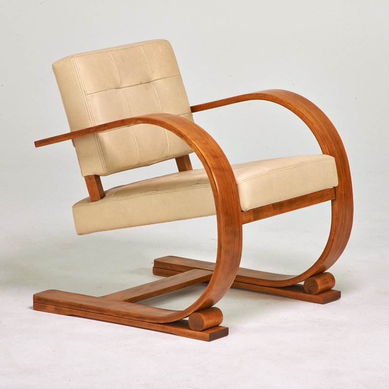 VIBOT: Cantilevered lounge chair, France, 1930s; Bent and laminated beech, leather; Unmarked; 28" x 25"