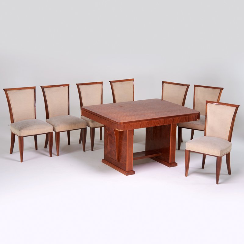 EUROPEAN ART DECO: Dining set: table and seven chairs, 1920s; Walnut, rosewood, upholstery; Table: 29 1/2" x 51" x 39", chairs: 36" x 19" x 23"