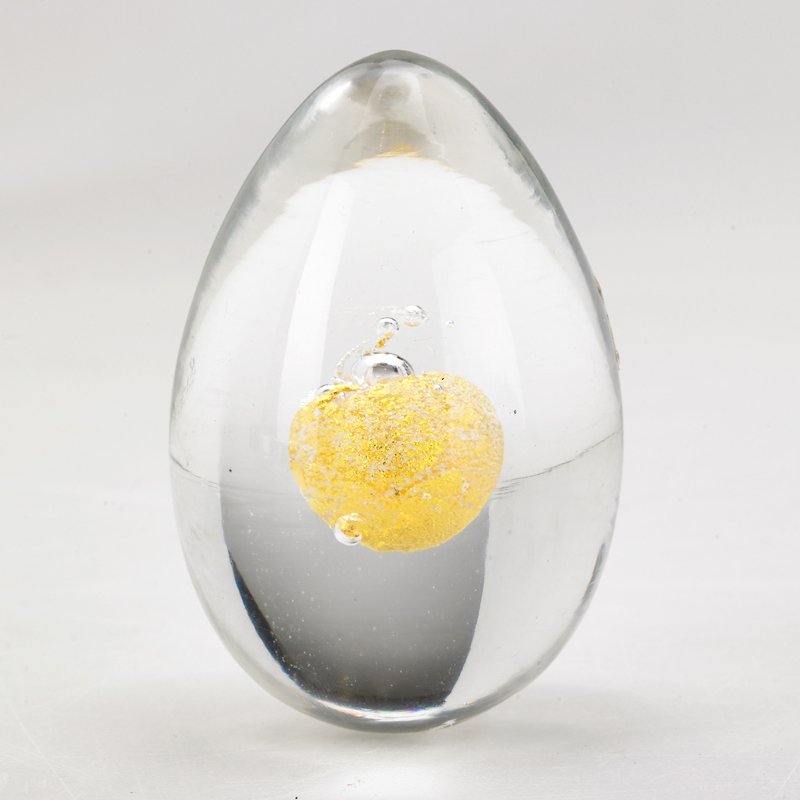 TAPIO WIRKKALA; VENINI: Blown glass egg with submerged gold foil yolk, Italy, 1960s; Etched marking and sticker label; 3" x 2" dia.