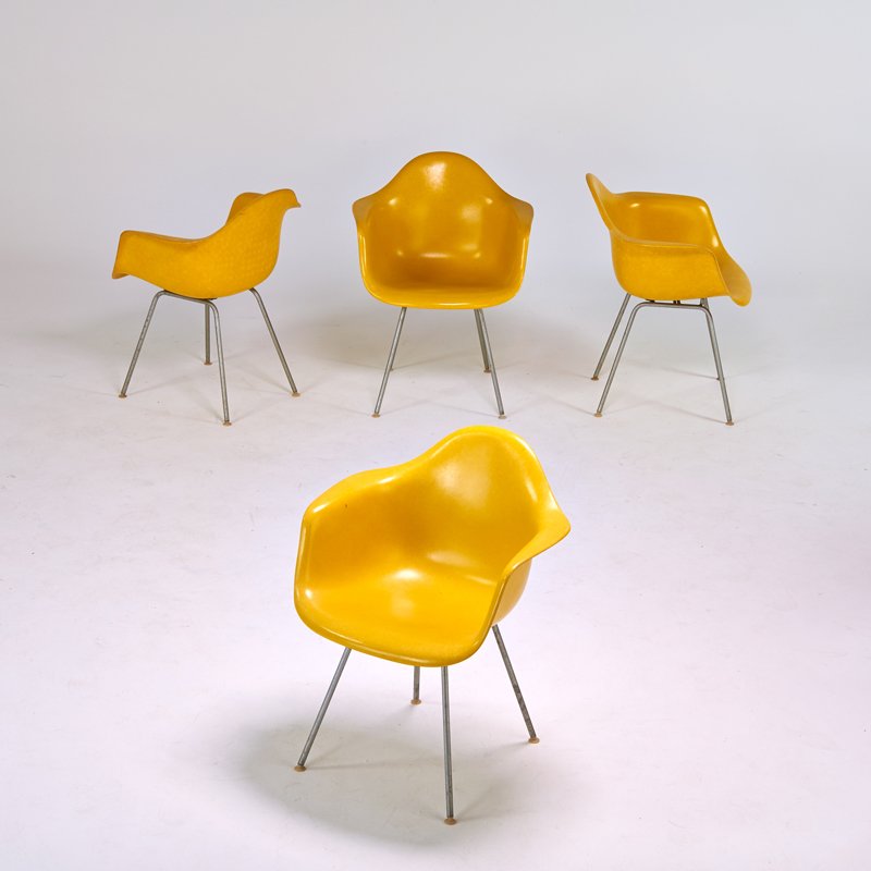 CHARLES AND RAY EAMES; HERMAN MILLER: Set of four shell armchairs, Zeeland, MI, 1960s; Plastic-reinforced fiberglass, chromed steel, rubber shock mounts; 31 1/2" x 25" x 24"