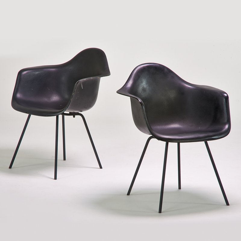 CHARLES AND RAY EAMES; HERMAN MILLER: Pair of shell armchairs, Zeeland, MI, 1950s; Plastic-reinforced fiberglass, chromed steel; Unmarked; 31" x 25" x 24"