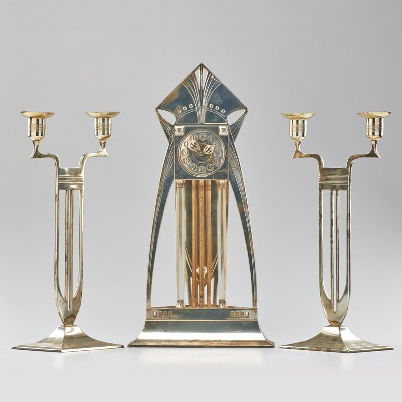 WMF: Silver-plated electric mantle clock and pair of two-light candlesticks, Germany, ca. 1930s; Unmarked; Clock: 17 1/2" x 9" x 5"
