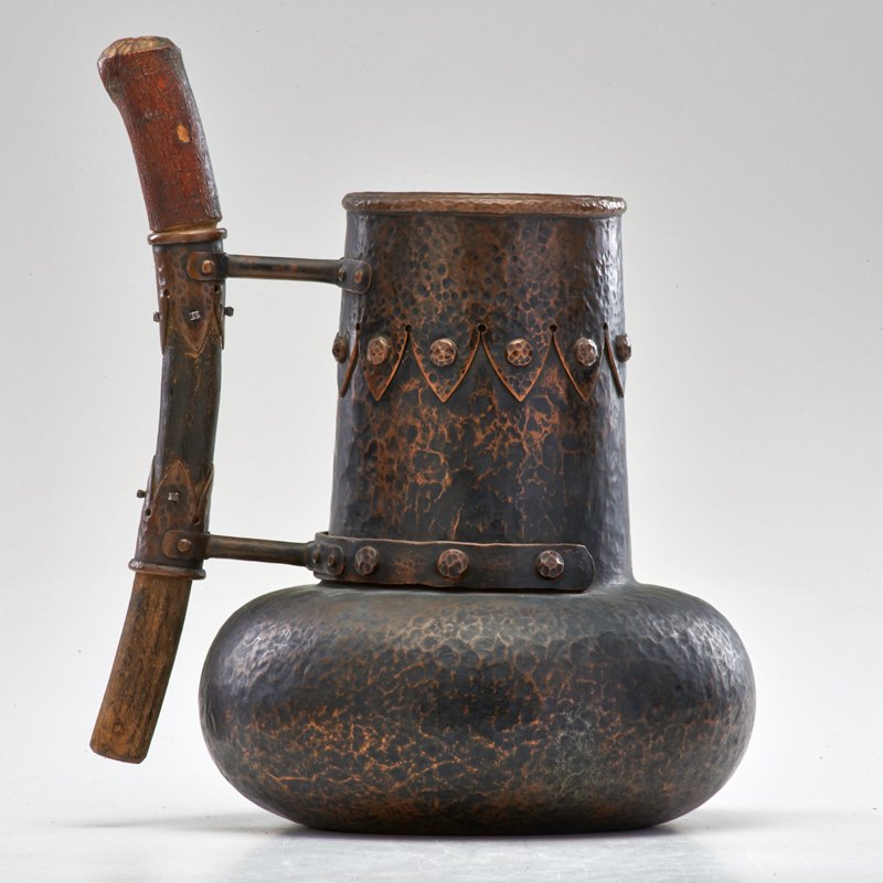 CHILEAN: Pitcher, 20th c.; Hand-hammered copper, wooden handle; Signed illegibly; 13" x 9" x 6 1/2"
