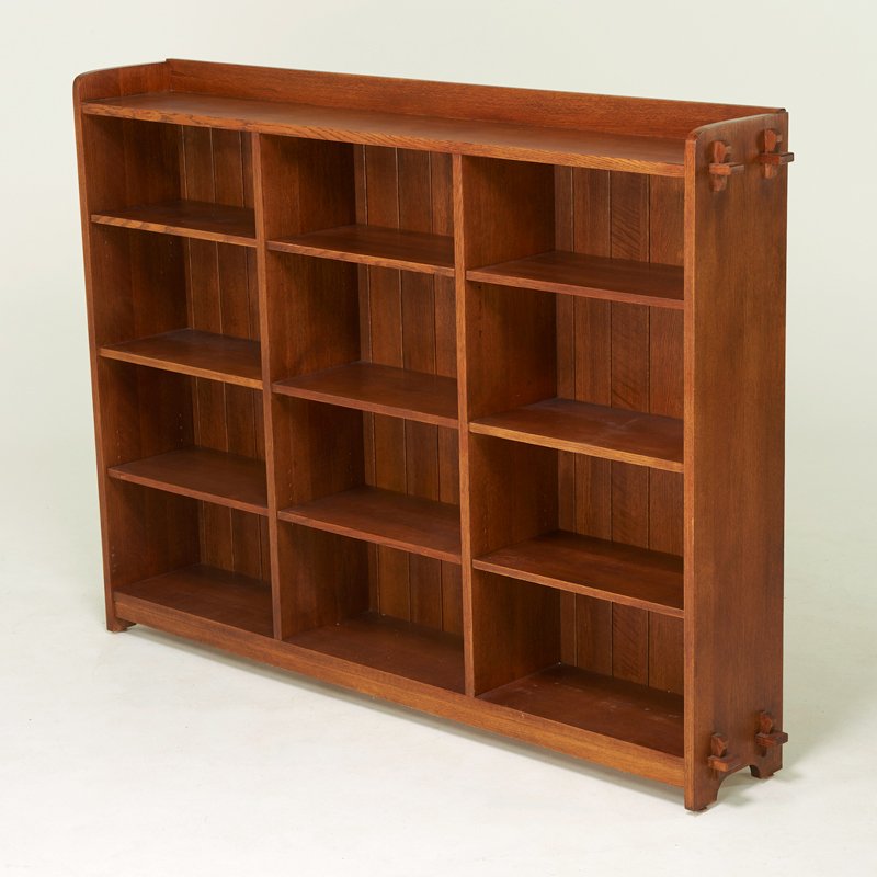 STICKLEY BY E.J. AUDI: Contemporary three-bay bookcase with adjustable shelves, Manilus, NY, ca. 1990s; Quartersawn oak; Branded mark and leather tag; 55" x 77" x 12"