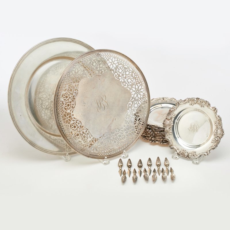 AMERICAN STERLING SILVER: Twenty-two pieces including: (8) Dominick and Haff 6 3/4" bread plates, (12) Frank Whitting hollow handled corn holders, etc., 20th c; All marked.; 70.2 OT excluding hollow handled