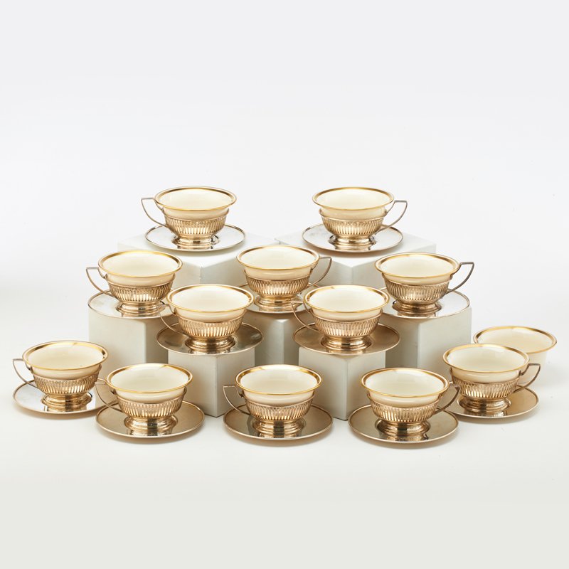 STERLING AND LENOX PORCELAIN CONSOMME SERVICE: Three piece service for twelve includes sterling pierced holder and plate by International and Lenox "wedding ring" liners, ca. 1930; Leafy script monogram B or R; 41.1 OT