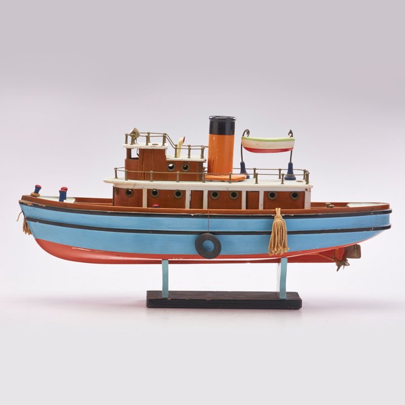 MODEL TUG BOAT: On stand, mid 20th c.; Painted wood; Unmarked; As shown: 9" x 18" x 5 1/2"