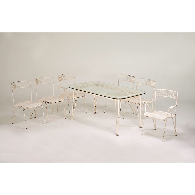 MAURIZIO TEMPESTINI; SALTERINI: Dining table and chairs, two arm- and four side-; Enameled iron, original glass top; Metal labels; Table: 29" x 60" x 36", arm: 33 1/2" x 25 1/2" x 23", side: 23 1/2" x 19 1/2" x 23"