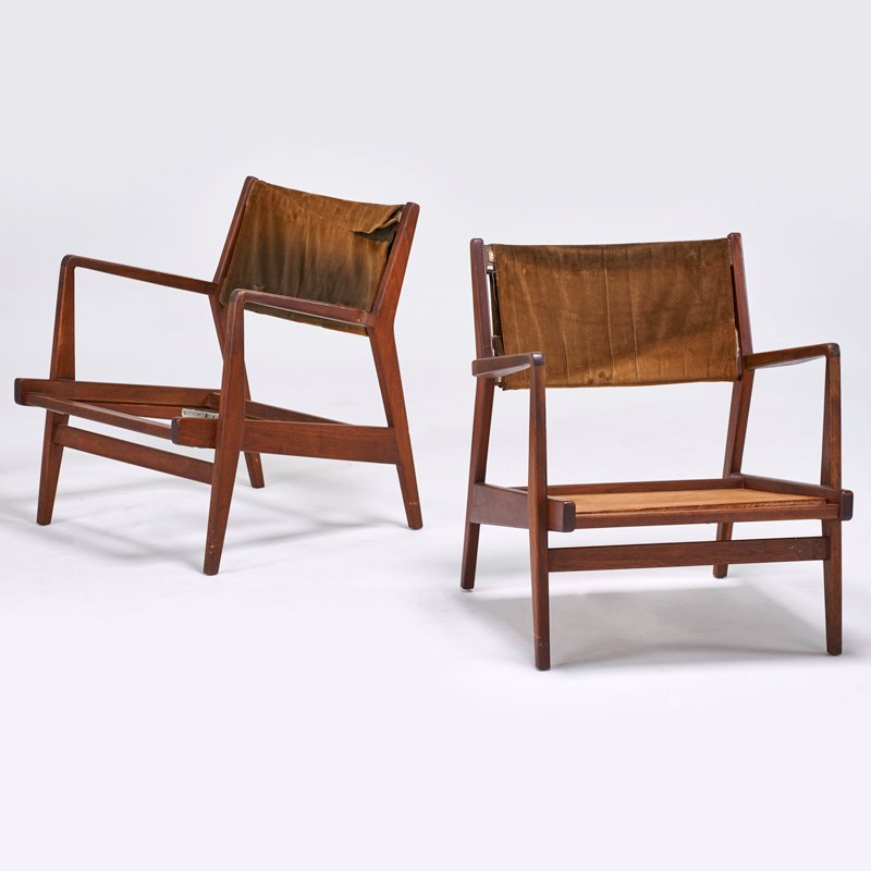 JENS RISOM; JENS RISOM DESIGN: Pair of lounge chairs, USA, 1950s; Sculpted walnut, upholstery; 29" x 27" x 28"