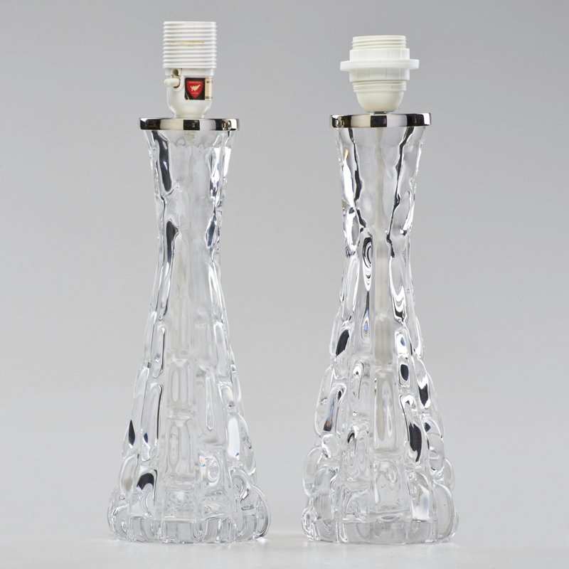 CARL FAGERLUND; ORREFORS: Two table lamps, model RD 1477, Sweden, 1960s; Chromed steel, glass; Both with manufacturer tag and etched mark; 15" x 5 1/2"