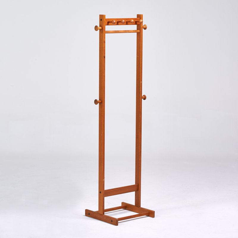 P.B.J. MOBLER: Teak coat rack, Denmark, 1970s; Manufacturer's label; 63" x 20 1/2" x 16"