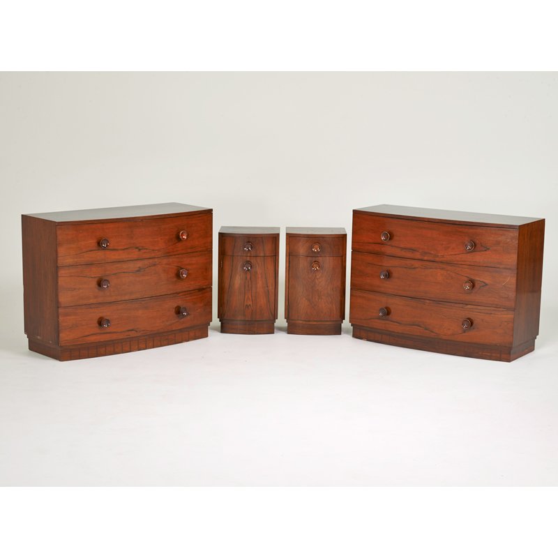 GILBERT ROHDE: HERMAN MILLER: Bedroom suite: pair of dressers (no. 3770), pair of nightstands (no. 3770), Zeeland, MI, 1940s; Brazilian rosewood, mahogany, stained wood handles; One foil label to dresser, stenciled numbers; Dresse