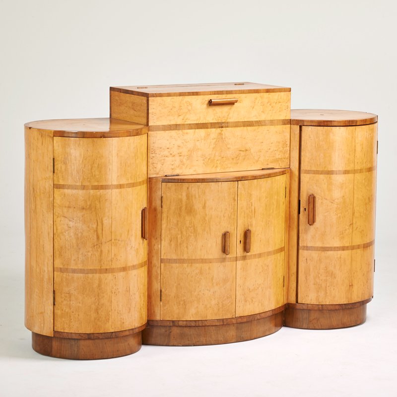 ENGLISH ART DECO: Bar cabinet, 1920s; Bird's eye maple, rosewood, walnut; Unmarked; Closed: 46" x 74" x 22", open: 58" x 74" x 28"