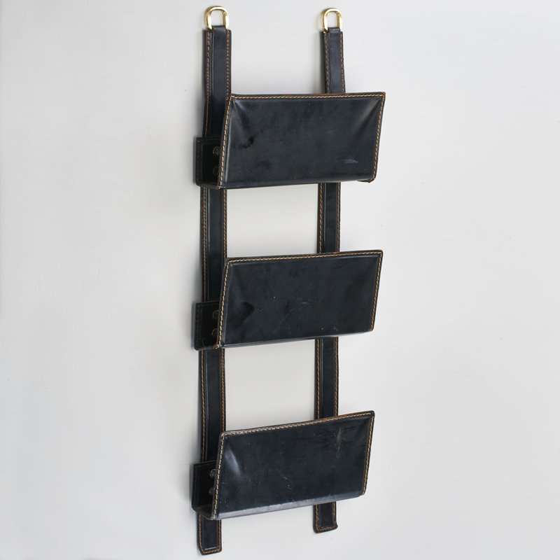 STYLE OF JACQUES ADNET: Leather magazine rack, France, ca. 1940s; Unmarked; 27" x 9" x 2"
