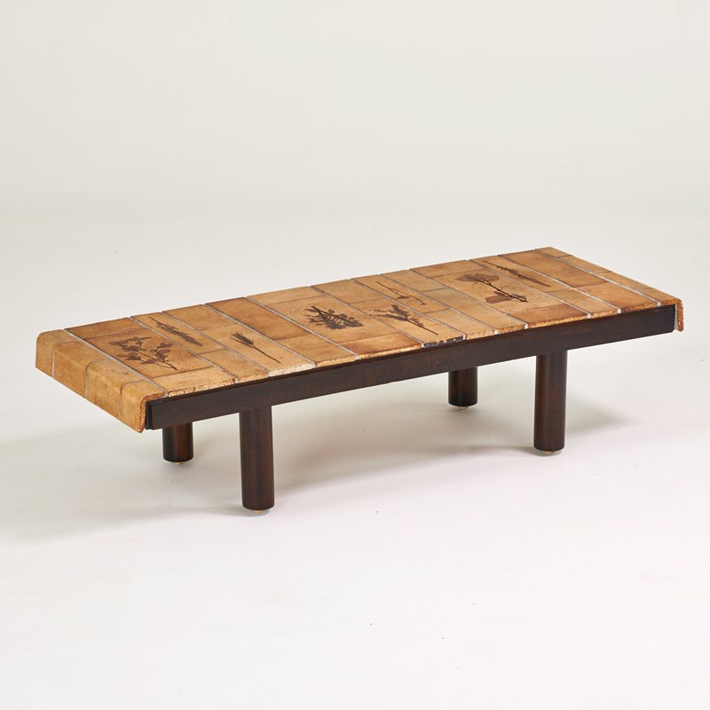 ROGER CAPRON: Coffee table, France, 1960s; Glazed earthenware tiles, stained wood; Signed R. CAPRON; 14" x 56" x 22"
