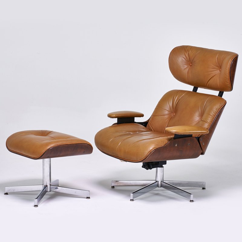 STYLE OF CHARLES AND RAY EAMES: Lounge chair and ottoman, USA, 1960s; Chromed steel, walnut, leather; Selig labels; 38" x 34" x 34", ottoman: 17" x 22" x 17"