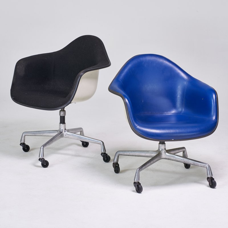 CHARLES AND RAY EAMES; HERMAN MILLER: Two armchairs, Zeeland, MI, 1960s; Aluminum, plastic reinforced fiberglass, vinyl, fabric upholstery; Manufacturer's markings; Taller: 31 1/2" x 25 1/2" x 22 1/2"