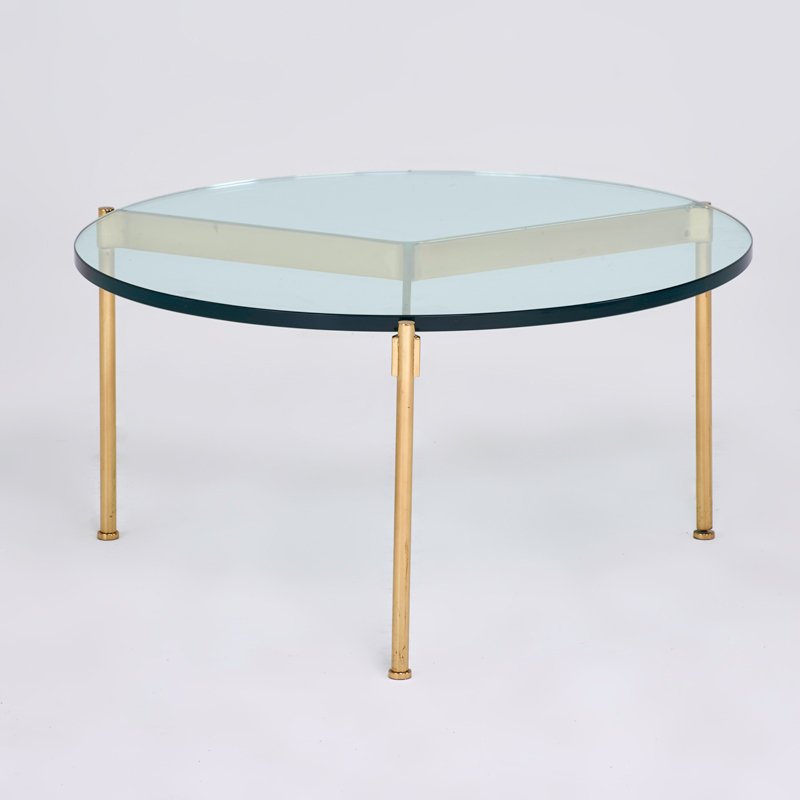 WARD BENNETT; BRICKELL: "Claw" cocktail table, USA, 1980s; Brass, glass; Unmarked; 15 3/4" x 30" dia.