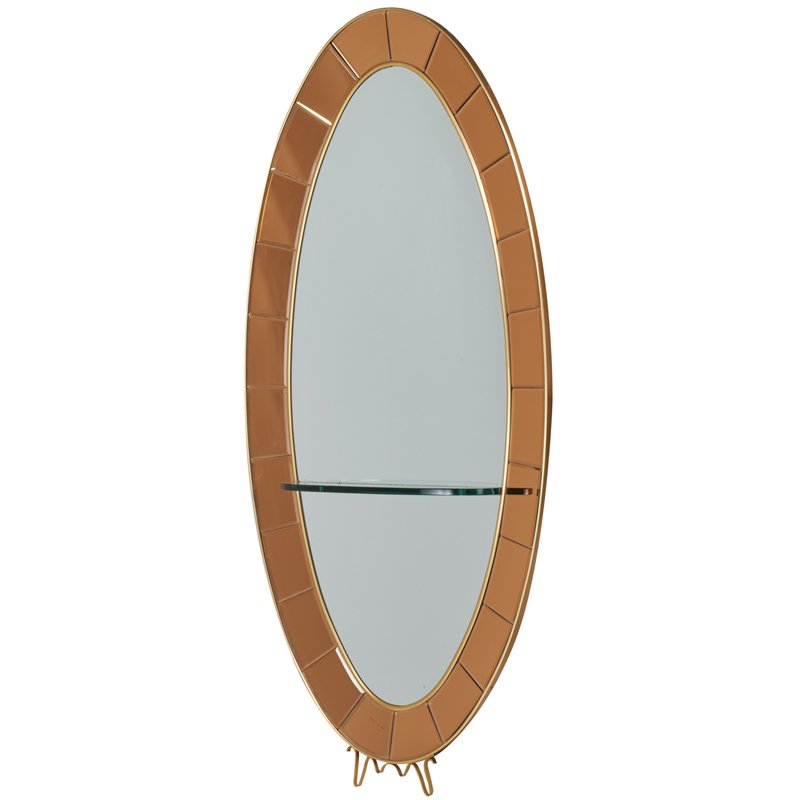 CRYSTAL ARTE: Oversized oval wall-hanging mirror with integrated shelf, Italy, 1960s; Mirrored glass, glass, beveled amber mirrored glass, brass, and wood veneer; Unmarked; 86" x 43" x 9 1/2"