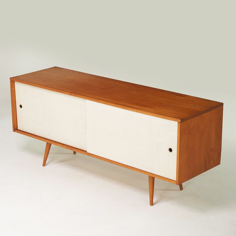 PAUL McCOBB; WINCHEDON: Planner Group cabinet, Winchendon, MA, 1950s; Birch, canvas, brass; Foil label; 25 1/2" x 60" x 18"