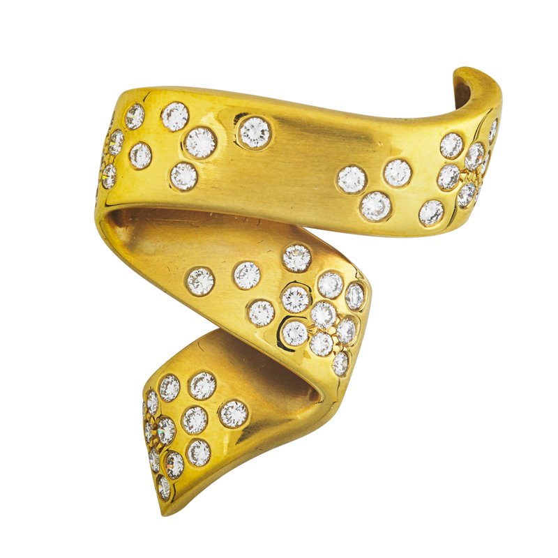 MARLENE STOWE DIAMOND AND 18K GOLD RIBBON BROOCH: Inset with 48 fine RBC diamonds, approx. 1.90 cts. TW, ca. 2000. Marked M. Stowe, 18k. 1 3/4" x 1 3/8". 11.8 dwt.