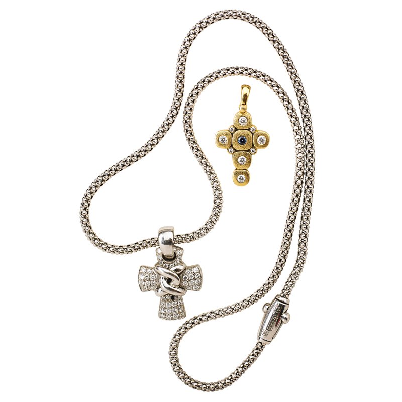 SEPKUS OR CHIMENTO DIAMOND 18K GOLD CROSS PENDANTS: Alex Sepkus "Candy" cross in 18k yellow gold with diamonds and sapphire, 1 1/16"; Chimento 18k wg. diamond pave wrapped cross, 1" on 16" chain. Diamonds approx. 1.40 cts., TW, ca. 2005. 13.8 dwt.