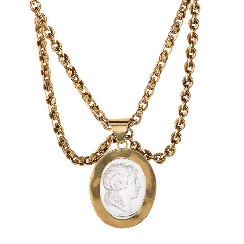 VICTORIAN ROCK CRYSTAL INTAGLIO ON CHAIN: Oval rock crystal with finely carved neoclassical portrait beveled and mounted in 14k yg. pendant with rope twist border on fancy link built festoon chain, 16", last quarter 19th c. Unmarked. Pendant