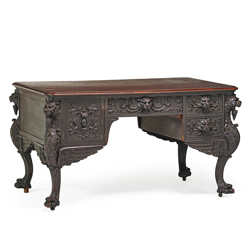 RENAISSANCE REVIVAL PARTNERS DESK: Mahogany carved frame with winged griffin supports and drawer fronts, 19th c.; 31 1/2" x 56 1/4" x 34 1/2"