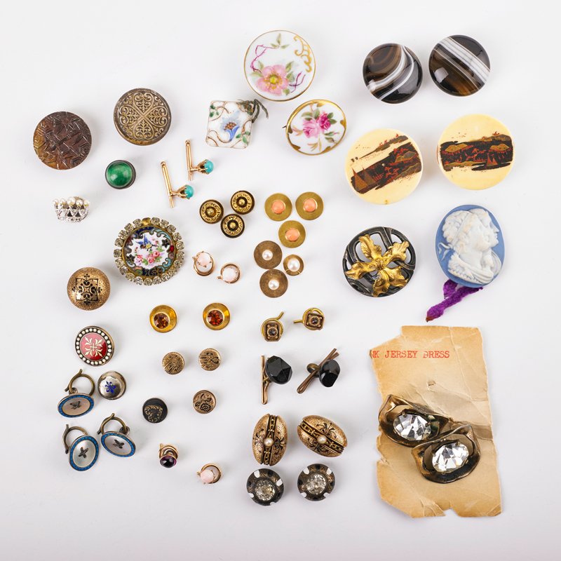 GROUP OF CUFFLINKS, BUTTONS & FINDINGS, SOME GOLD: 14k white gold diamond and seed pearl crown pin; Pair of scenic carved hand painted bone buttons; Early Victorian enamel and paste studs; Banded agate studs; Etc. 1860-1960. 18.3 dwt. GW (gold element