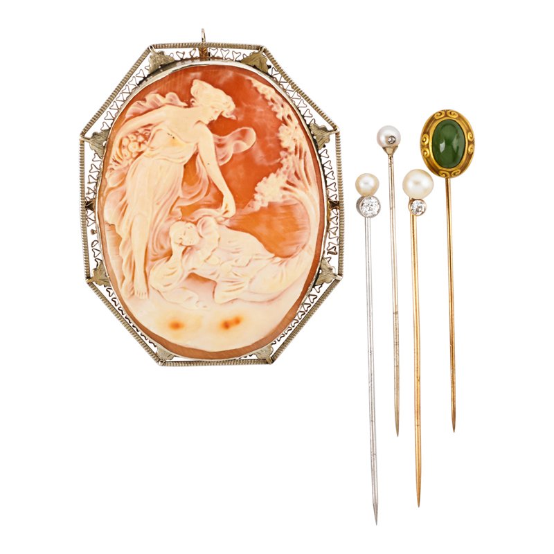 COLLECTION OF ANTIQUE STICK PINS AND CAMEO: Five pieces: Four stick pins: one green hardstone and yellow gold, three with pearls and diamonds, approx. .40 ct. TW; Carved shell cameo depicting a fairy visiting a clown, in 14k wg. frame. First qu
