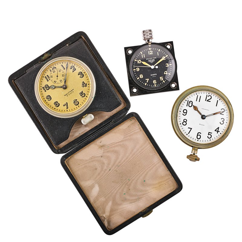 THREE DASHBOARD OR TRAVEL CLOCKS: Heuer Mastertime rally racing eight-day stopwatch, #16.8433, serial #218808, ca. mid 20th century, "as new" in box; Tiffany & Co. eight-day 72 mm. clock by Waltham, #22485327, ca. 1919; Waltham Watch 