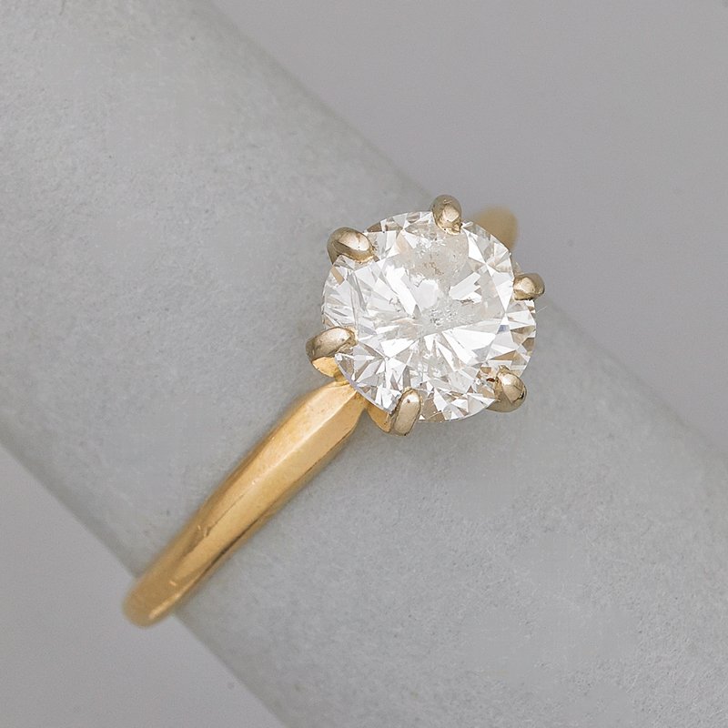 DIAMOND 14K GOLD SOLITAIRE RING: Circular brilliant cut diamond with faceted girdle, approx. 1.60 cts., ca. 1965. Size 7 1/2. 1.8 dwt.