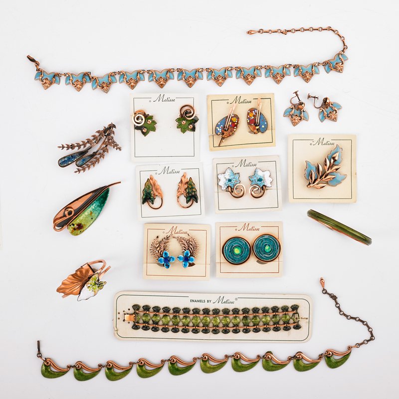 22 PIECES ENAMELED COPPER JEWELRY, MATISSE, RENOIR: Collection in blue-green colors: Seven pairs ear clips, three brooches, three bracelets, two link necklaces. Organic and geometric motifs. Many on original cards. All elements marked Matisse or Matiss