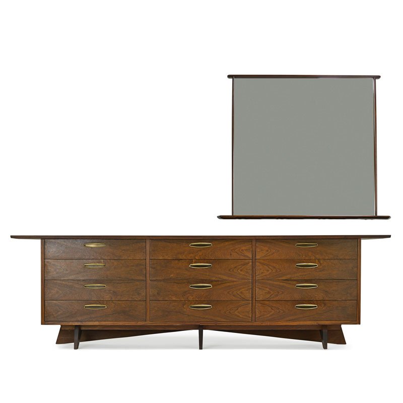 NAKASHIMA; WIDDICOMB Origins cabinet and mirror: GEORGE NAKASHIMA (1905 - 1990) WIDDICOMB Origins cabinet and mirror, Grand Rapids, MI, ca. 1959 Walnut, brass, mirrored glass Branded, manufacturer label 32" x 105 1/2" x 22", mirror: 43 1/2" x 52 1/2