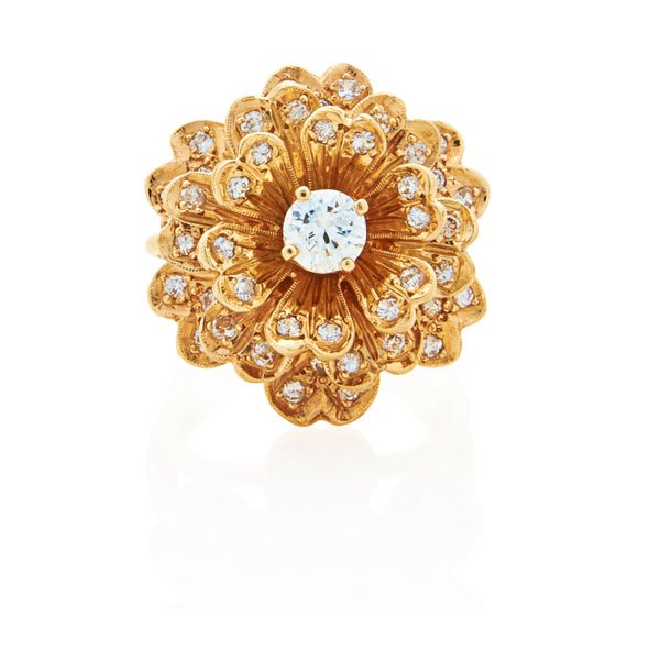 14K YELLOW GOLD DIAMOND ROSETTE RING: Highly dimensional millegrained, diamond set petals center RBC diamond, approx. .50 ct., melee approx. .80 ct. TW. Second half 20th c. Unmarked. Size 6. 7.6 dwt.