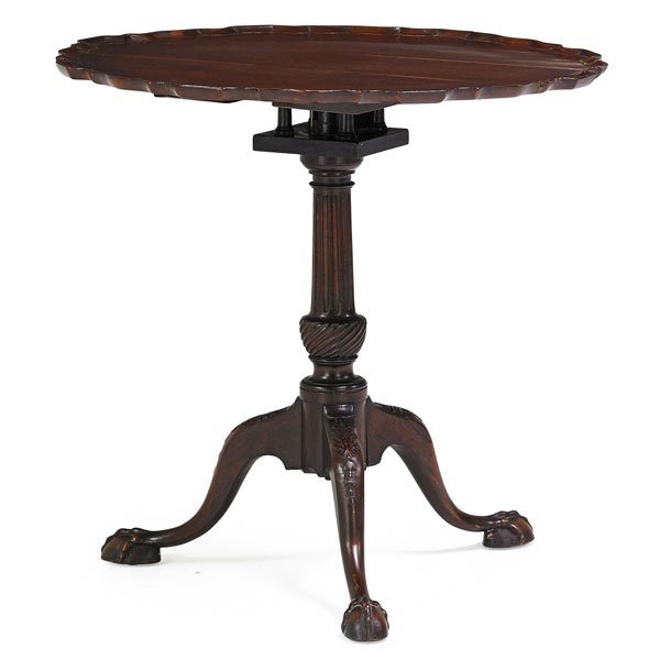 CHIPPENDALE MAHOGANY PIE CRUST TABLE: Tilt-top on tripod base, with ball and claw feet, probably America, 19th c. 28 1/2" x 30" dia.