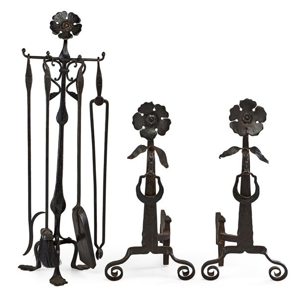 ARTS AND CRAFTS FIREPLACE SET: Seven pieces: pair of floral decorated andirons, poker, tongs, shovel and holder, wrought iron and bronze, early 20th c. Andirons: 24" x 1"