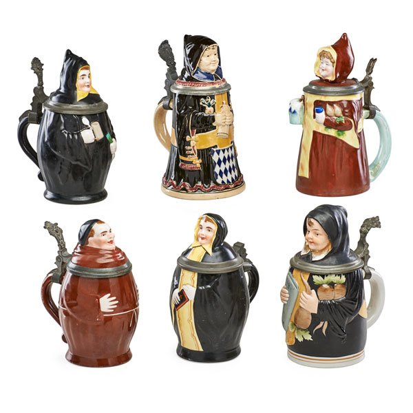 GERMAN CHARACTER STEINS: Six: Four nuns and two monks, all pewter mounted with figural lids, Germany, early 20th c. Largest: 8 1/2" x 5 1/2" x 4 1/4"