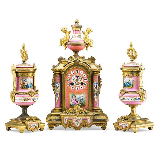 LOUIS XVI STYLE PORCELAIN GARNITURE SET: Gilt-bronze mounted, comprising a clock and a pair of urns, each decorated with figural reserves on pink ground, late 19th c. Clock: 17 1/4"