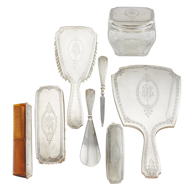 GORHAM STERLING SILVER DRESSER SET: Eight pieces: glass jar with lid, three brushes, comb, mirror, shoe horn, nail file and associated tray, U.S.A., 1916; Marked; Jar: 3 1/2"; Weighable: 2.35 OT