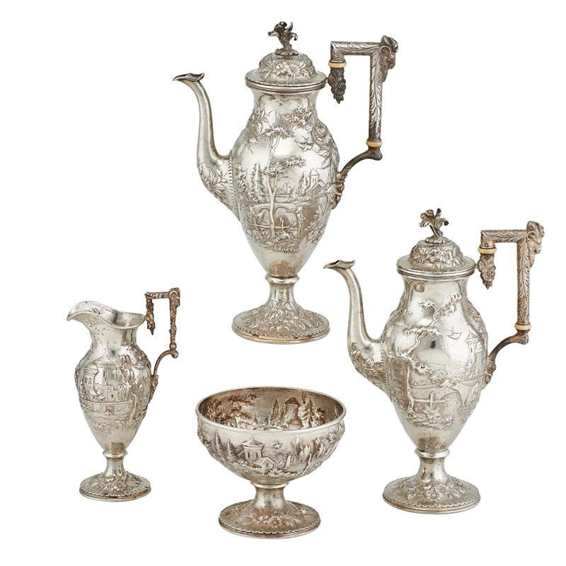 S. KIRK & SON STERLING SILVER REPOUSSE TEA SET: Four pieces: each decorated with pastoral scenes and floral reserves, teapot and coffeepot with floral finials and ram's mask crested handles, U.S.A., second quarter 20th c.; Largest: 13" x 9 1/2" ; 9