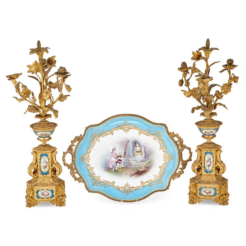 SÃˆVRES CENTERPIECE TRAY WITH GARNITURE: Three pieces: garniture with painted porcelain floral reserves and gilt bronze floral sprays with associated SÃ¨vres porcelain centerpiece tray, France, late 19th c.; Tray is signed: L. Heri with S�