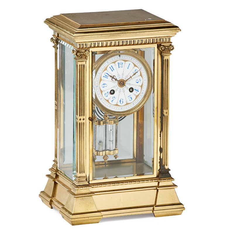 TIFFANY & CO. CRYSTAL REGULATOR: Crystal and brass regulator mantle clock, porcelain clock face adorned with classical decoration and scrolling blue numerals, Japy FrÃ¨res movement, U.S.A., ca. 19th c.; Marked; 14 1/2" x 9" x 7 1/4